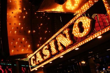 Slot game interface showing reels, spin button, and win display on mobile